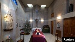 The body of former Pope Benedict is displayed at the Vatican