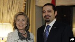 Lebanese Prime Minister Saad Hariri shakes hands with US Secretary of State Hillary Rodham Clinton in New York, 07 Jan 2011