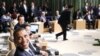 President Barack Obama smiles at reporters at the start of the Leaders Retreat at the APEC summit in Yokohama, Japan, Saturday, Nov. 13, 2010. (AP Photo/Charles Dharapak)