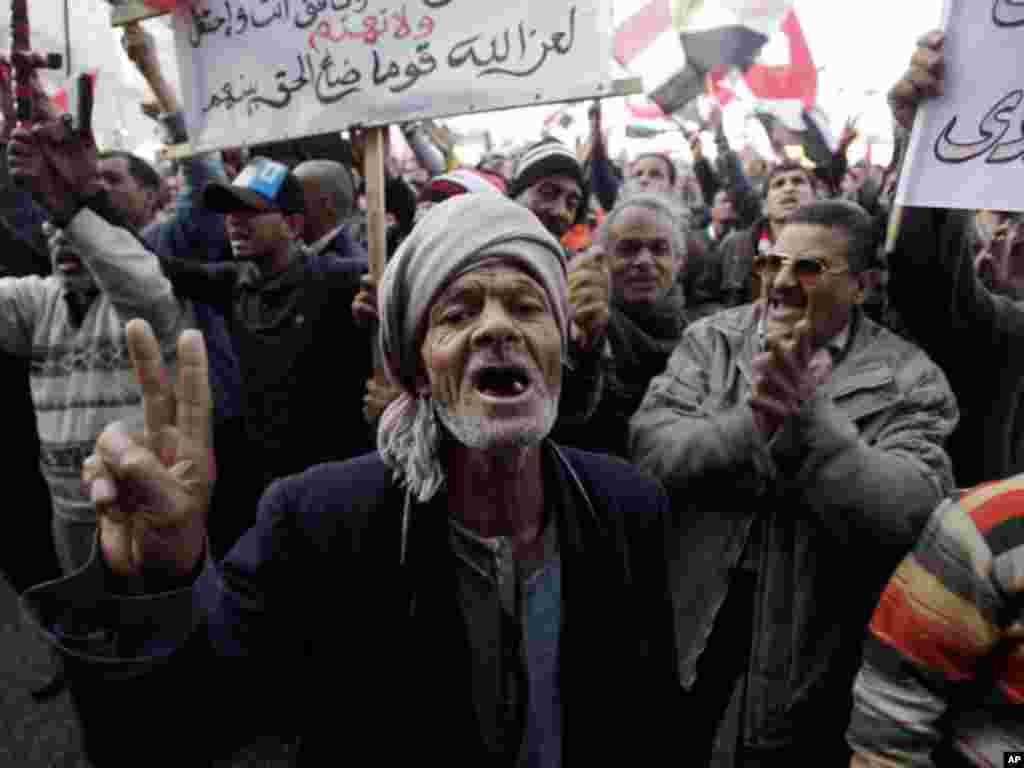 On January 25, 2012, an Egyptian man chants slogans as thousands gather in Cairo to mark the one year anniversary of the uprising that ousted Hosni Mubarak. (AP)