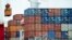 FILE - A container is loaded onto a cargo ship at the Tianjin port in China, Aug. 5, 2010. With the apparent death of the Trans-Pacific Partnership, China sees a chance at forming its own Pacific free trade area. 