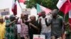 FILE - Joe Ajaero, centre, Nigerian Labor Congress president, speaks during a protest against the recent increase in the electricity tariff, in Abuja Nigeria, on May 13, 2024.