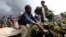 A boy sells Cassava leaves at a market in Bunagana, eastern Democratic Republic of Congo, Oct. 19, 2012.