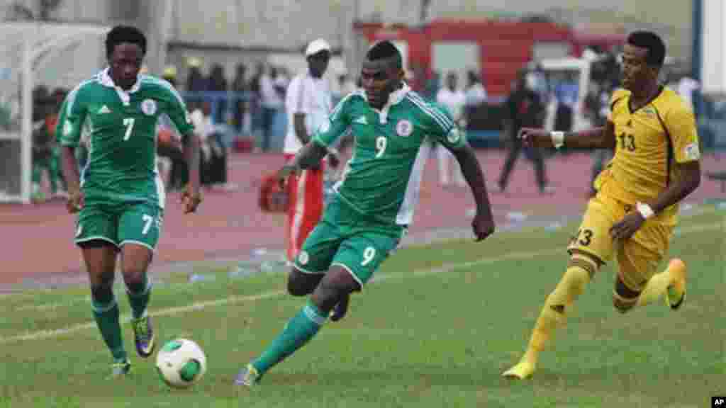 Nigeria&#39;s Musa Ahmed, left, Emenike Emmanuel, centre, vie for the ball against Ethiopia&#39;s Salahadin Bargicho, right, during their 2014 World Cup qualifying playoff match.