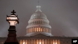 FILE - The U.S. Capitol in Washington is shrouded in mist, Dec. 13, 2019.