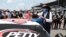 Driver Bubba Wallace, left, is comforted by team owner Richard Petty, as he arrives at his car in the pits of the Talladega Superspeedway prior to the start of the NASCAR Cup Series in Talladega Ala., Monday June 22, 2020. 