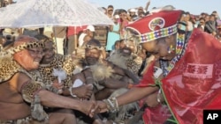 South African President Jacob Zuma marries his fiancee Bongi Ngema (R) at a traditional ceremony at his home in Nkandla, KwaZulu Natal province, April 20, 2012.
