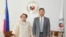 This handout photo taken on October 19, 2026 and released by the Department of Foreign Affairs shows Philippine Secretary of the Department of Foreign Affairs Maria Theresa Lazaro (L) and China's Ambassador to the Philippines Jing Quan.