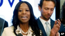 Surrounded by her family, Rep. Mia Love, R-Utah, talks about election results in the 4th Congressional District at the Utah Republican Party headquarters, Nov. 26, 2018, in Salt Lake City.