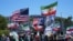تجمع مخالفان جمهوری اسلامی مقابل ورزشگاه، با پرچم‌های شیر و خورشید و آمریکا و تصاویر ترامپ، جدال پرچم‌ها را به دیدار ایران و نیوزیلند کشاند.