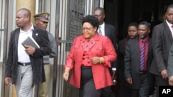 FILE: Joice Mujuru leaves the magistrates courts in Harare, Monday, Feb. 6, 2012, on the last day of the long awaited inquest hearing into the mysterious death of her husband Zimbabwe's former army General Solomon Mujuru.