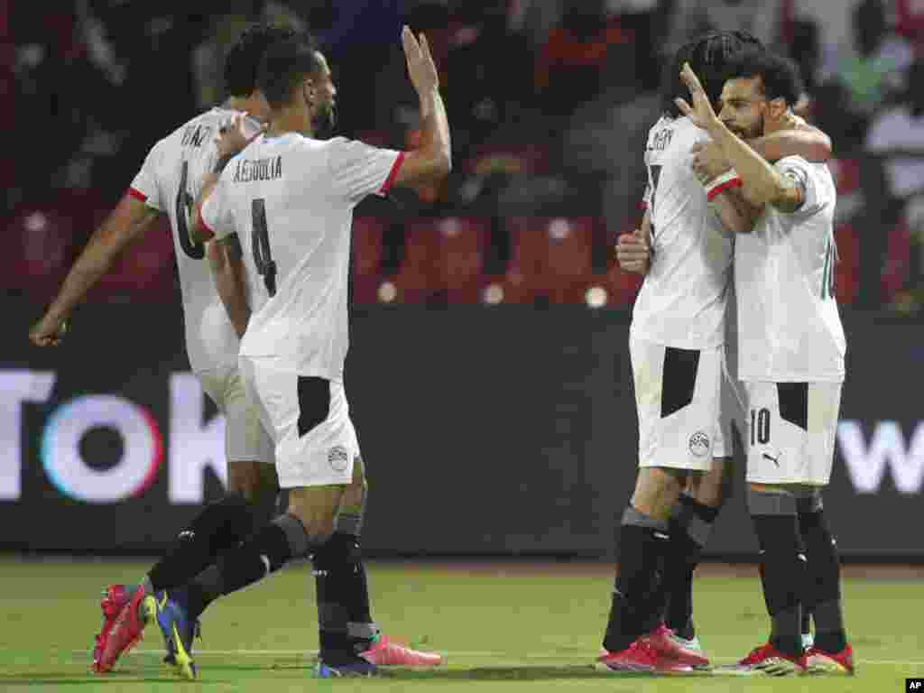 Egypt&#39;s players celebrate during the soccer match between Egypt and Guinea-Bissau, Jan. 15, 2022.