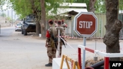 FILE - French soldiers guard the entrance to the Base Aerienne Projetee in N'Djamena on May 14, 2024. 