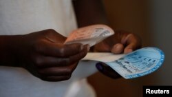 FILE: A voter casts his ballot in the general elections in Harare, Zimbabwe, July 30, 2018. 