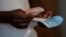 A voter casts his ballot in the general elections in Harare, Zimbabwe, July 30, 2018. 
