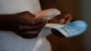 A voter casts his ballot in the general elections in Harare, Zimbabwe, July 30, 2018. 