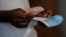 A voter casts his ballot in the general elections in Harare, Zimbabwe, July 30, 2018.