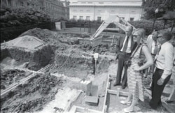 President Gerald R. Ford and his daughter Susan Ford survey construction on the new swimming pool on the South Grounds on May 20, 1975.