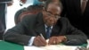 Mugabe Signs New Zimbabwe Constitution Into Law