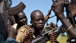 FILE - South Sudan government soldiers in the town of Koch, Unity state, South Sudan. The government of Sudanese President Omar al-Bashir says it has never used children in armed conflicts.