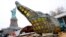 The original torch of the Statue of Liberty rests on a transporter, Nov. 15, 2018 in New York. The torch was being moved to a new museum on Liberty Island. 