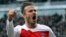 An April 6, 2013 photo, shows PSG's David Beckham celebrating after scoring a goal against Rennes during their French League One soccer match, in Rennes, western France. 