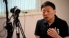 FILE- Wang Zhi'an speaks during an interview with the Associated Press in Tokyo on Oct. 5, 2022. Wang, as well as artist-turned-dissident Li Ying, said in separate posts Feb. 25, 2024, that police were interrogating people who followed them on social media.