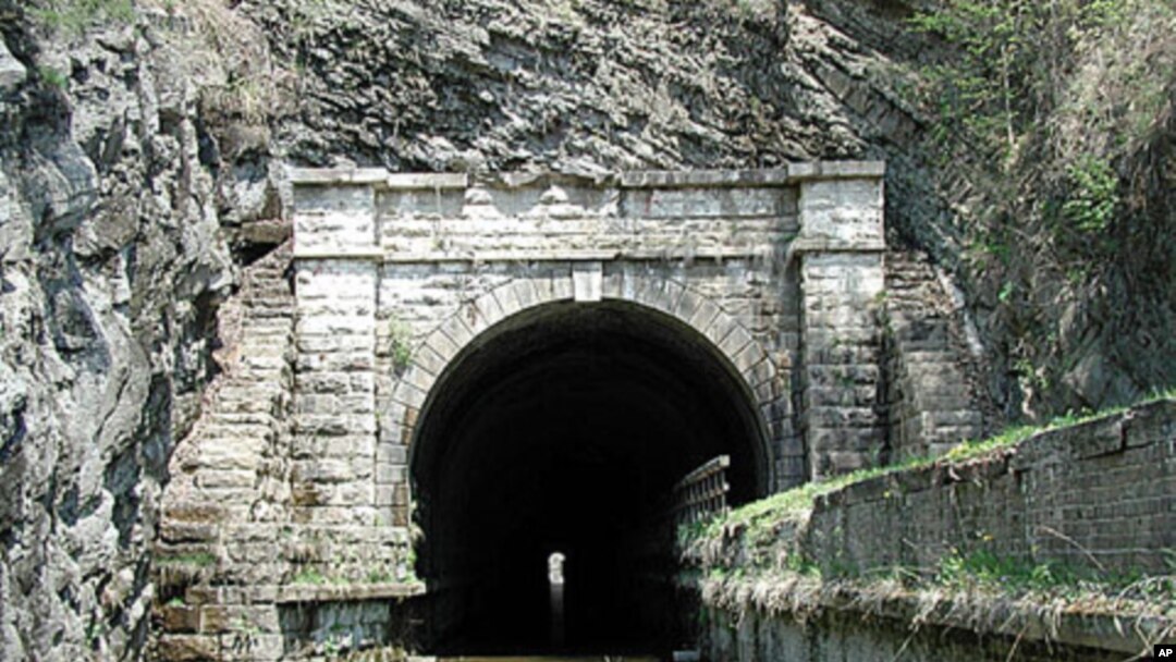 This is the famous Paw Paw Tunnel on the canal, through which boats could travel only one way at a time. The tunnel bypasses a section of the Potomac River containing five horseshoe bends.