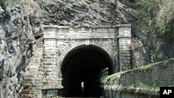 This is the famous Paw Paw Tunnel on the canal, through which boats could travel only one way at a time. The tunnel bypasses a section of the Potomac River containing five horseshoe bends.