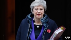 Britain's Prime Minister Theresa May leaves 10 Downing Street in London on Oct. 31, 2018, ahead of the weekly Prime Minister's Questions session in the House of Commons. 