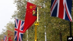 British, Chinese flags along the Mall near Buckingham Palace, London, Oct. 16, 2015.