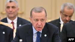 FILE - In this handout photograph taken and released by Kazakhstan's Presidential Press Service on Nov. 3, 2023, Turkey's President Recep Tayyip Erdogan attends the 10th Summit of the Council of Heads of State of the Organization of Turkic States, in Astana.
