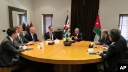 FILE - Presidential advisers Jared Kushner, center left, and Jason Greenblatt, third left, meet with Jordan's King Abdullah II, center right, and his advisers, in Amman, Jordan, May 29, 2019, as part of discussions of a new Middle East peace plan.