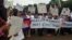 Cambodian-Americans have gathered in front of the White House in Washington, DC, July 12, 2013, to demand reforms to the Cambodian National Election Committee ahead of July 28 parliamentary elections. (VOA Khmer)