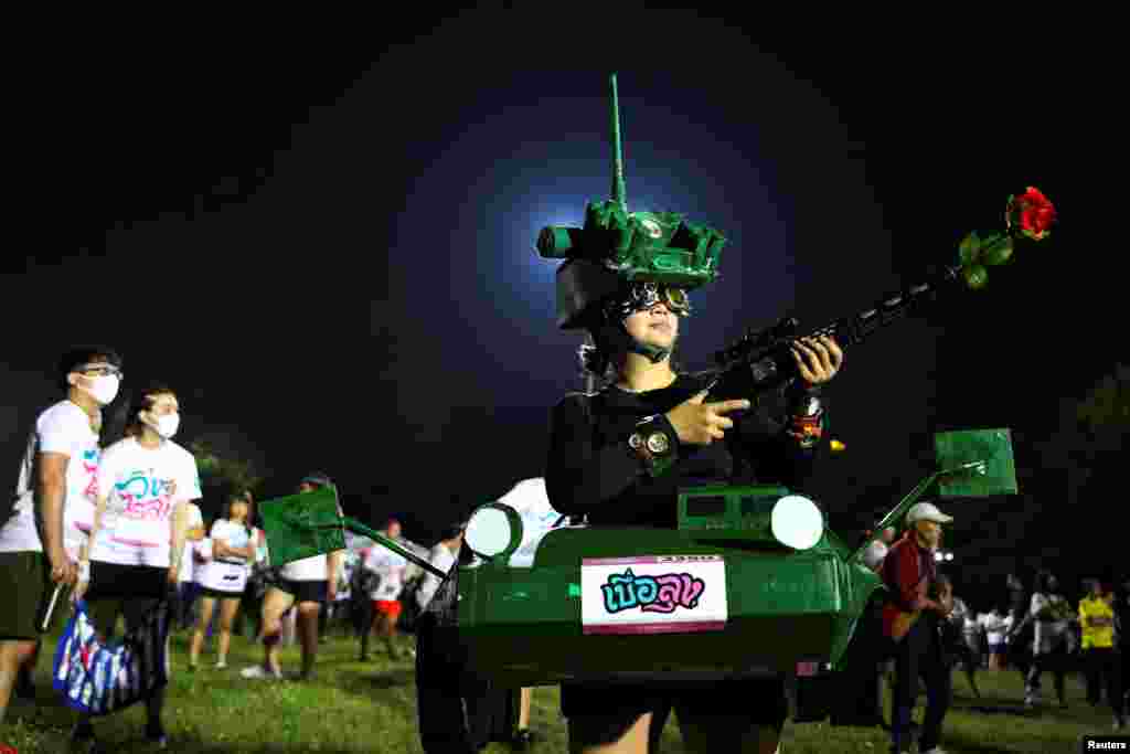A runner dressed in a tank costume takes part in the &quot;Run Against Dictatorship&quot; event at a public park in Bangkok, Thailand.