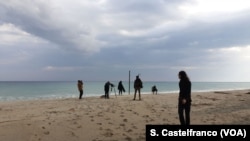 Team shooting with migrants on Stignano beach, Calabria, Italy. 