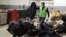 Workers from an environmentally-friendly rubbish disposal business called ScrapApp sort through garbage in a shopping mall in Noida, India, Aug. 11, 2016. 