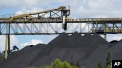 FILE - coal stack at a train loading facility near Muswellbrook in the Hunter Valley, Australia, Nov. 2, 2021. Activists want all mining projects in Australia to be properly assessed for their potential impact on climate change. 