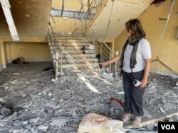 VOA reporter Ingyin Naing stands in a police station under the control of the Karenni Interim Executive Council, where prisoners were held. On September 5, around 10 a.m., a military junta warplane bombed this location.