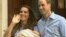 In this image from video, The Duke and Duchess of Cambridge leave the Lindo Wing of St Mary's Hospital in London, July 23 2013, carrying their new-born son, the Prince of Cambridge who was born Monday, into public view for the first time.