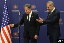 U.S. Secretary of State Antony Blinken, left, and Turkish Foreign Minister Hakan Fidan leave after a news conference at the ministry headquarters in the Turkish capital, Ankara, on Dec. 13, 2024.