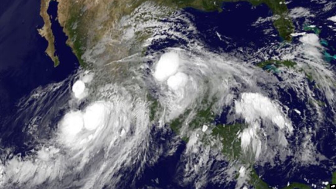 FILE - Hurricane Ingrid in the Gulf of Mexico approaching the coast of Mexico and tropical storm Manuel just off the western coast of Mexico, 15, 2013. 