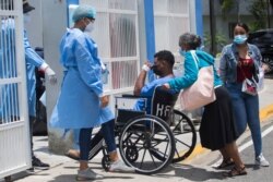 A man is admitted at the COVID unit of the Moscoso Puello hospital in Santo Domingo, Dominican Republic, June 2, 2021, as the country suffers a spike in the number of positive cases.