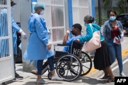 A man is admitted at the COVID unit of the Moscoso Puello hospital in Santo Domingo, Dominican Republic, June 2, 2021, as the country suffers a spike in the number of positive cases.