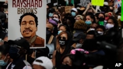 People gather in front of the Georgia State capitol for a protest that coincides with the return of the legislative session, June 15, 2020, in Atlanta. The NAACP March to the Capitol coincided with the restart of the Georgi