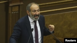 Armenian opposition leader Nikol Pashinyan addresses lawmakers during a parliament session to elect an interim prime minister in Yerevan, Armenia, May 1, 2018.