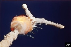 FILE - The space shuttle Challenger is destroyed shortly after lifting off from Kennedy Space Center, Fla., Tuesday, Jan. 28, 1986. (AP Photo/Bruce Weaver, File)