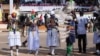 South Sudanese dance and wave flags during celebrations marking three years of Independence at a stadium in Juba, July 9, 2014. 