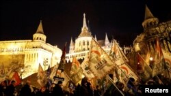 People protest after Hungarian Prime Minister Viktor Orban delivered his annual state of the nation address in Budapest, Hungary, Feb. 10, 2019.