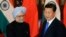 China's President Xi Jinping (R) shakes hands with India's Prime Minister Manmohan Singh before their meeting at the Diaoyutai State Guesthouse in Beijing October 23, 2013. REUTERS/Peng Sun/Pool (CHINA - Tags: POLITICS) - RTX14KSF
